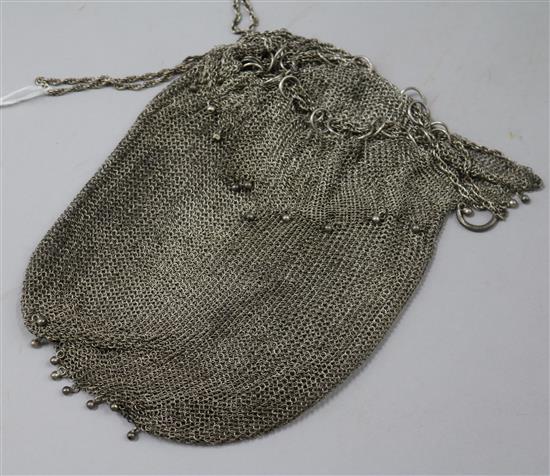 A white metal mesh evening bag.